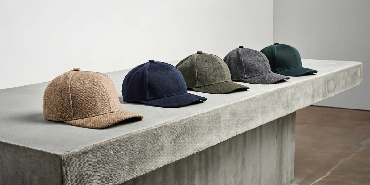 A collection of Beisbol Dandy streetwear hats in various styles.