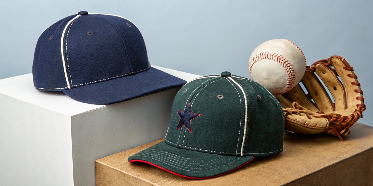 Two streetwear style 31 Hats beisbol hats with a baseball and glove.