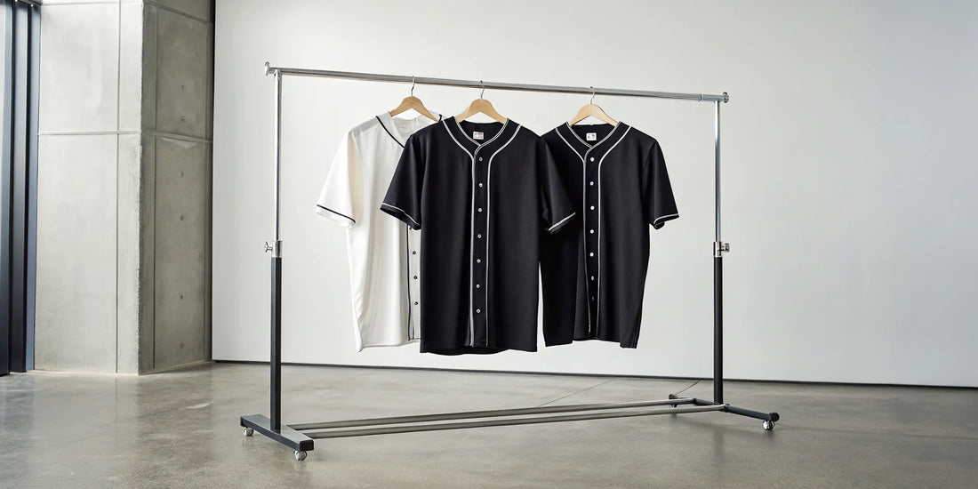 A rack of black and white Zacatecas baseball jerseys in a classic button-down style.