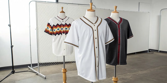 Button-down Aztec baseball jerseys in black and white with detailed cultural designs.