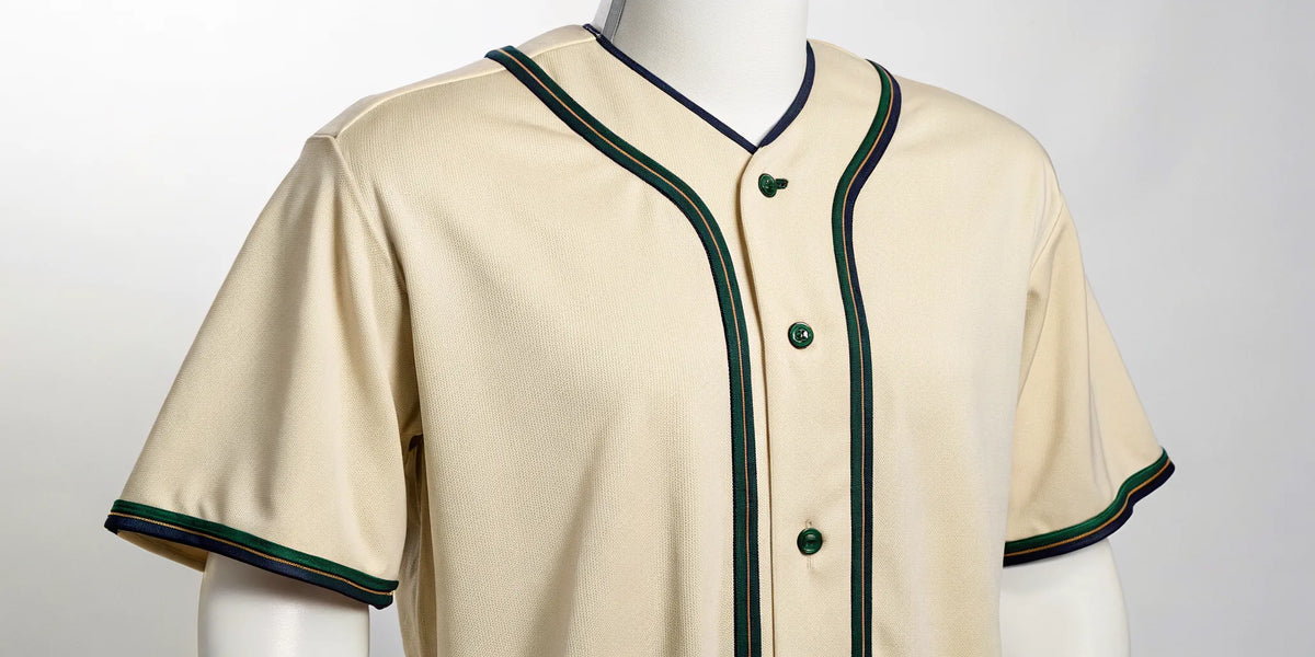 Classic button-up Sonora baseball jersey in cream with green and navy trim.