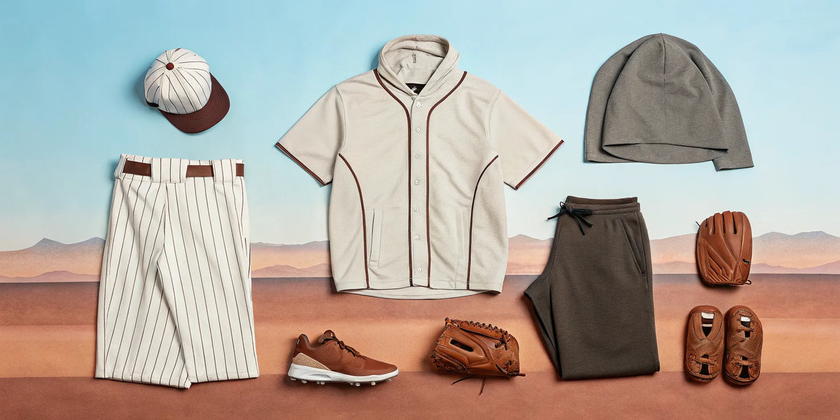 A collection of Arizona beisbol athletic apparel, including a jersey and cap, in a desert setting.