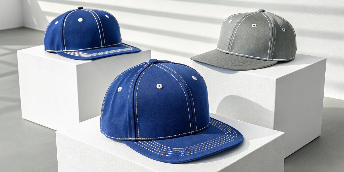 Various styles of blue and gray beisbol Dodgers hats.